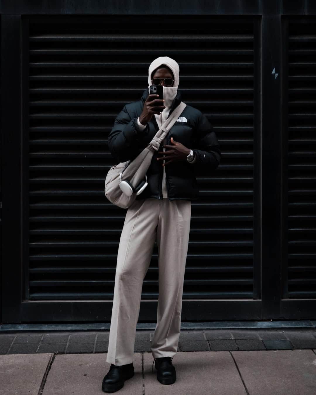 Winter streetwear, black coat and scarf