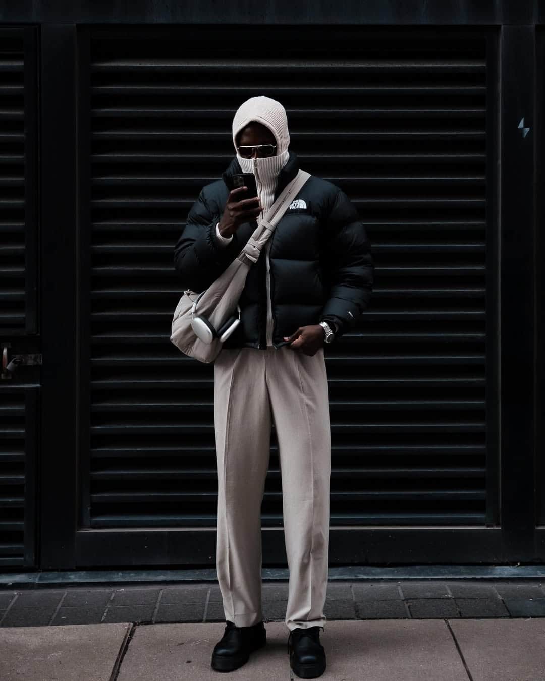 Winter streetwear, black coat and scarf