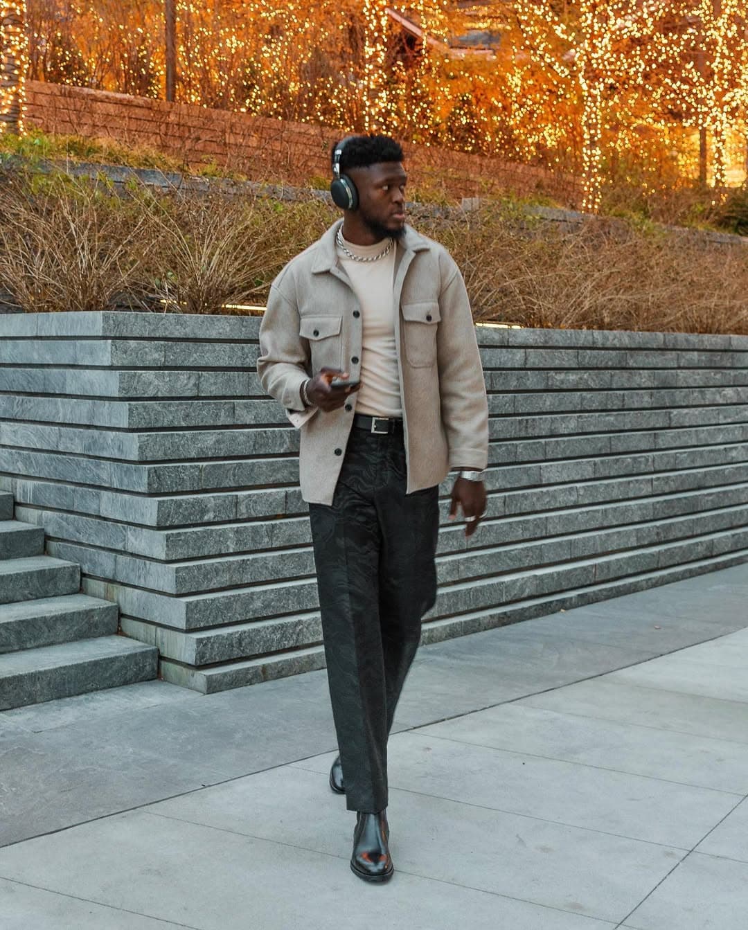 Aldo shoes winter boots campaign, tan shacket and headphones